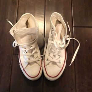 Women’s white high top converse.